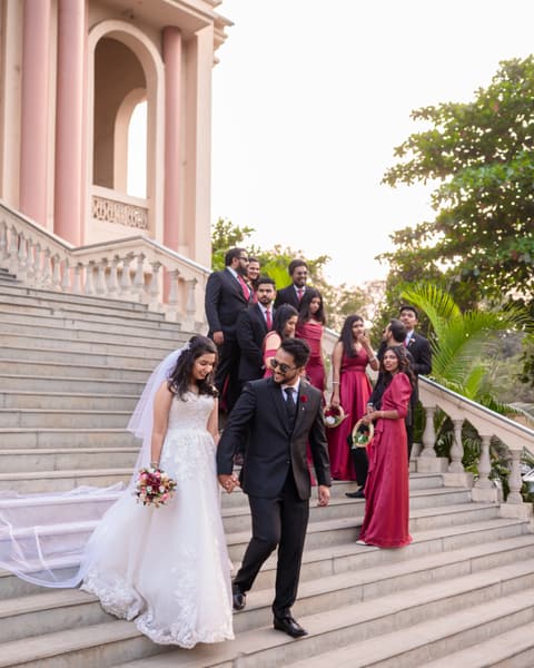 Couple and the bridal party on the church steps